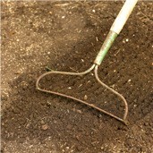 Rake soil smooth